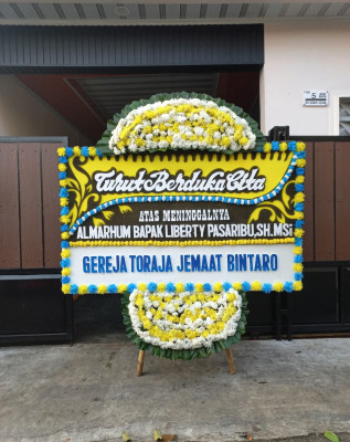 Papan Bunga Duka di Tiom Ollo