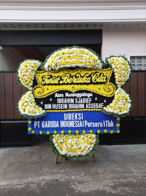 Papan Bunga Duka di Tiom Ollo
