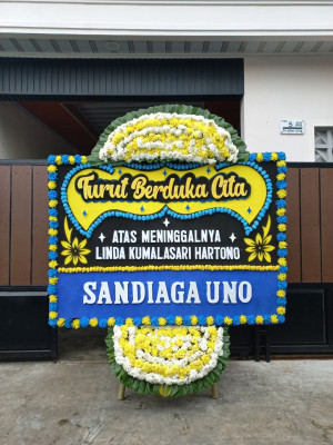 Papan Bunga Duka di Tiom Ollo